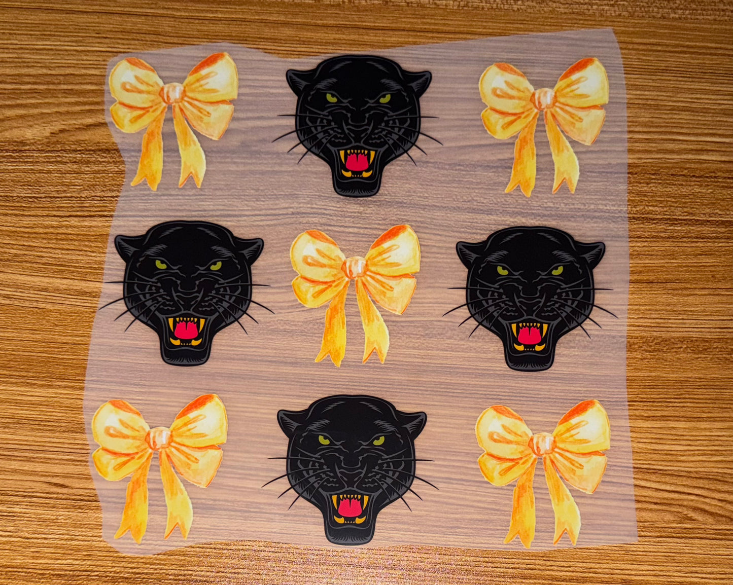 PANTHER WITH GOLD BOWS PRINT