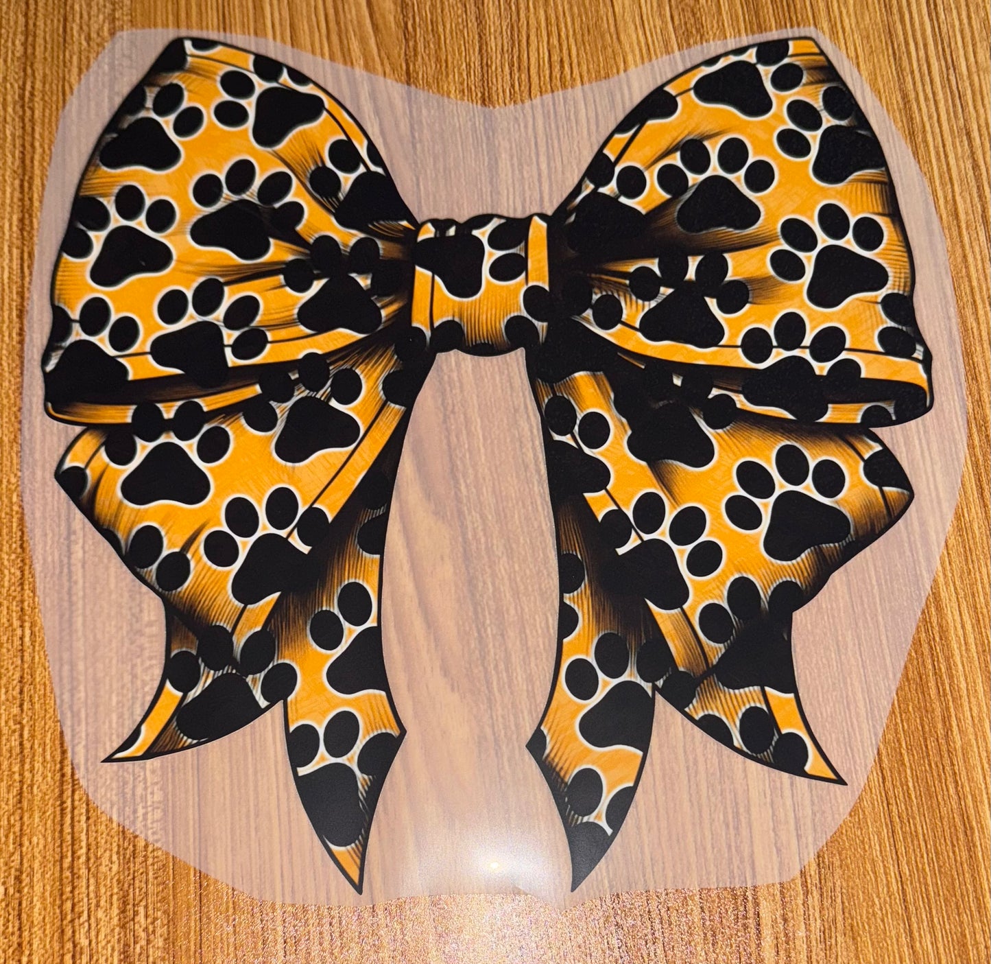 GOLD BOW WITH BLACK PAWS PRINT